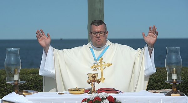 Father Jeffrey L. Nowak, of St. Vincent de Paul Parish, Niagara Falls, presides over the 91st annual Pilgrimage and Mass at the Father Millet Cross at Old Fort Niagara Sept. 10. The Knights of Columbus and area Catholics also celebrated the Mass. Since 1926, the Knights of Columbus have been celebrating a Mass at 